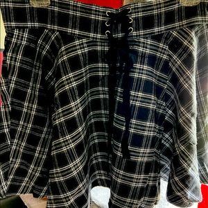 Tartan miniskirt with tie detail.